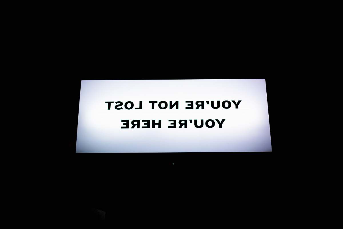 text turned-on flat screen TV paper